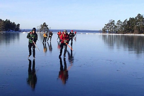 a group of people in a boat on a body of water
